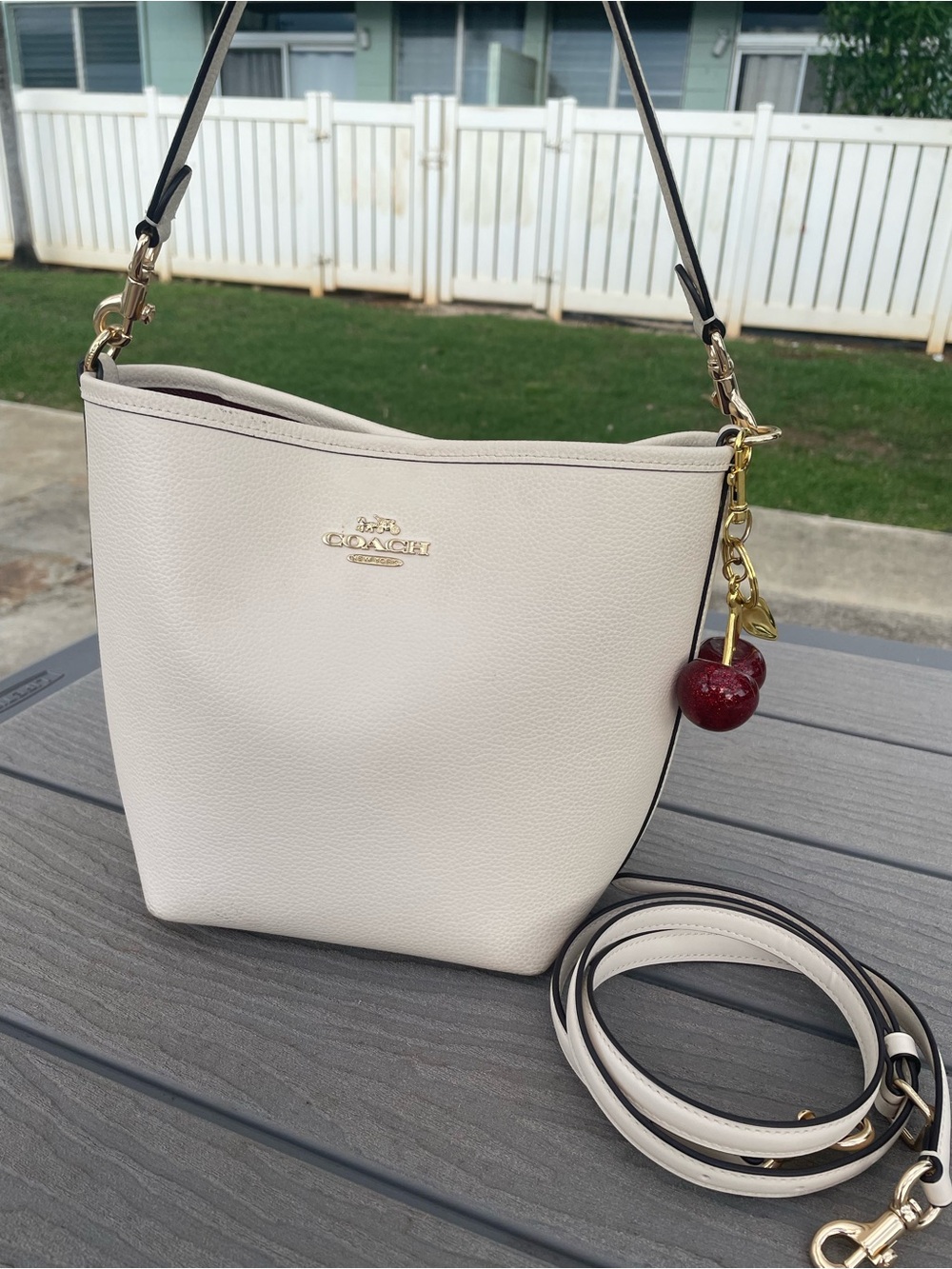 Coach Cream Pebbled Leather Shoulder Bucket Bag with Cherry Charm